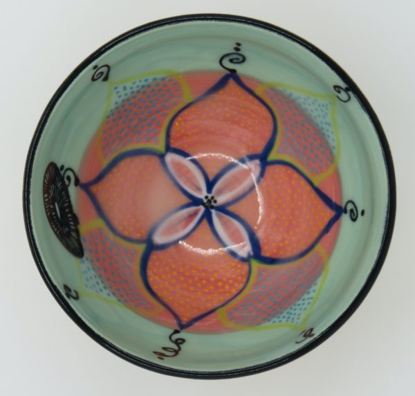 This bowl is a good size for serving small portions of things. It measures approximately, 5" in diameter x 2 3/4" tall. The outside is Tangerine on the bottom and Buttercup on the top. It has a random abstract black line drawing design with turquoise accents. The inside is Sea Grass on Top and Red on the bottom and has an open flower and more abstract line drawings.